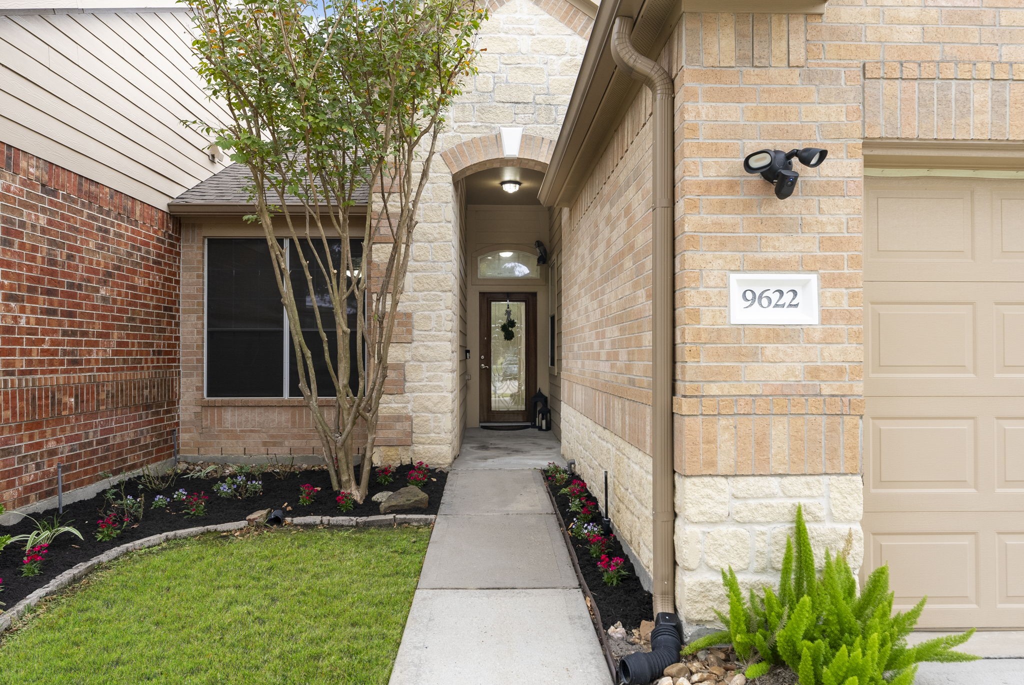 9622 Old Timber Lane Spring, TX 77379 - Photo 3 of 50 a front view of a house with a yard