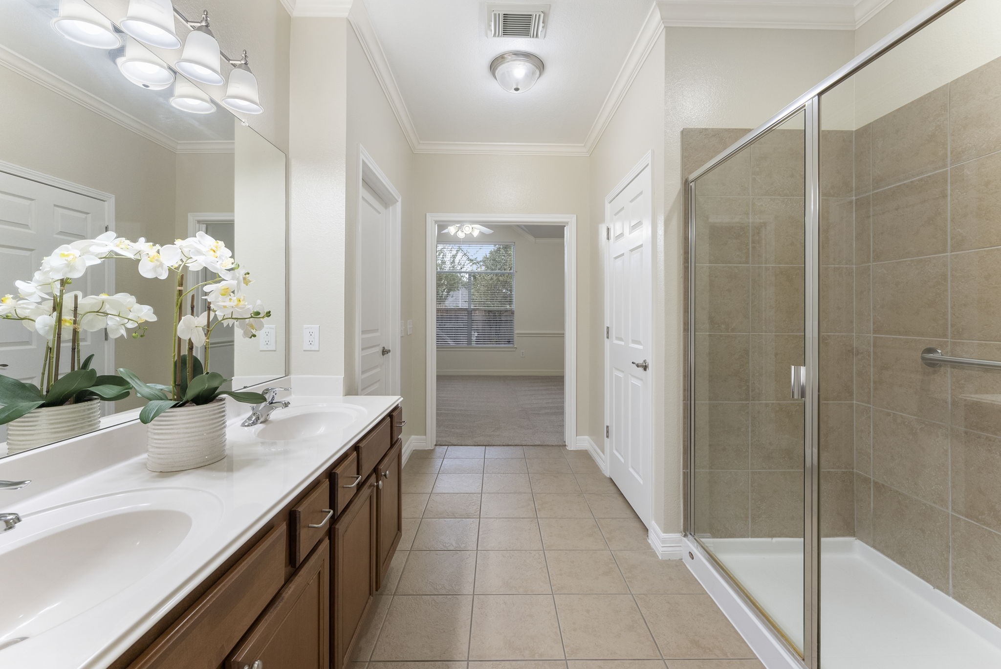 9622 Old Timber Lane Spring, TX 77379 - Photo 41 of 50 a spacious bathroom with a granite countertop sink a mirror and a shower