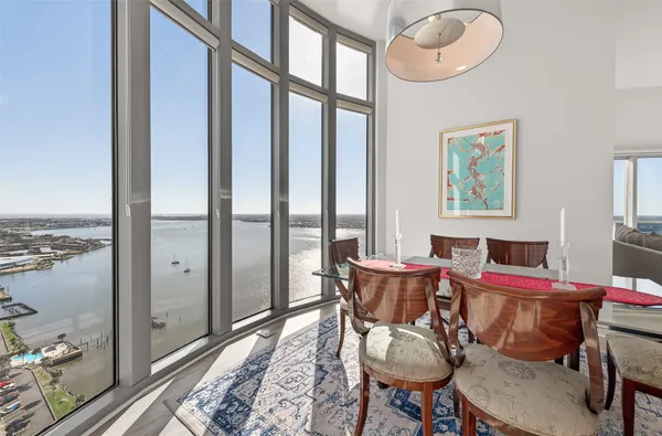 a living room with furniture and view of kitchen