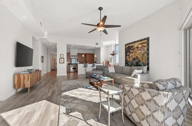 a kitchen with sink stove and wooden floor