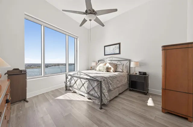 a bathroom with a tub a sink and mirror