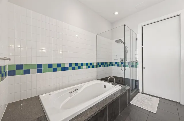 a bedroom with a bed and a chair