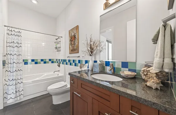 a living room with furniture and book shelf