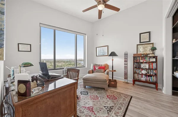a view of entryway and hall with a chair