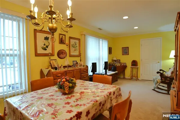 a bed room with a bed mirror and a table