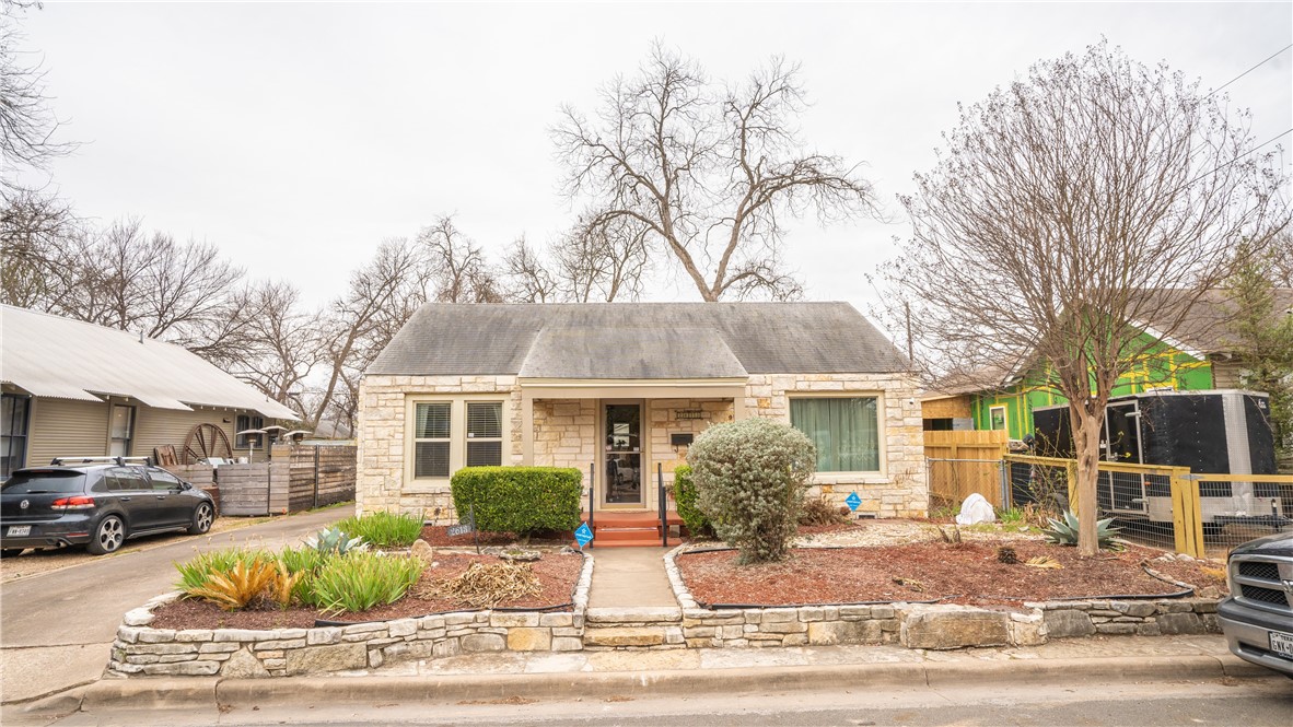 a front view of a house with garden