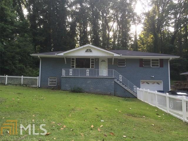 2663 Delowe Drive, Unit 4 East Point, GA 30344 - Photo 1 of 1 a front view of a house with a garden