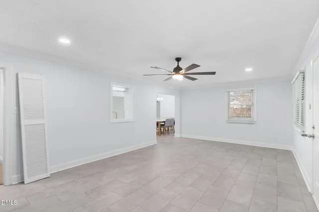 a living room with a fireplace and a rug