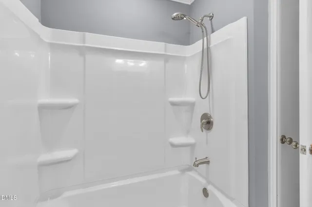 a bathroom with a sink toilet and mirror