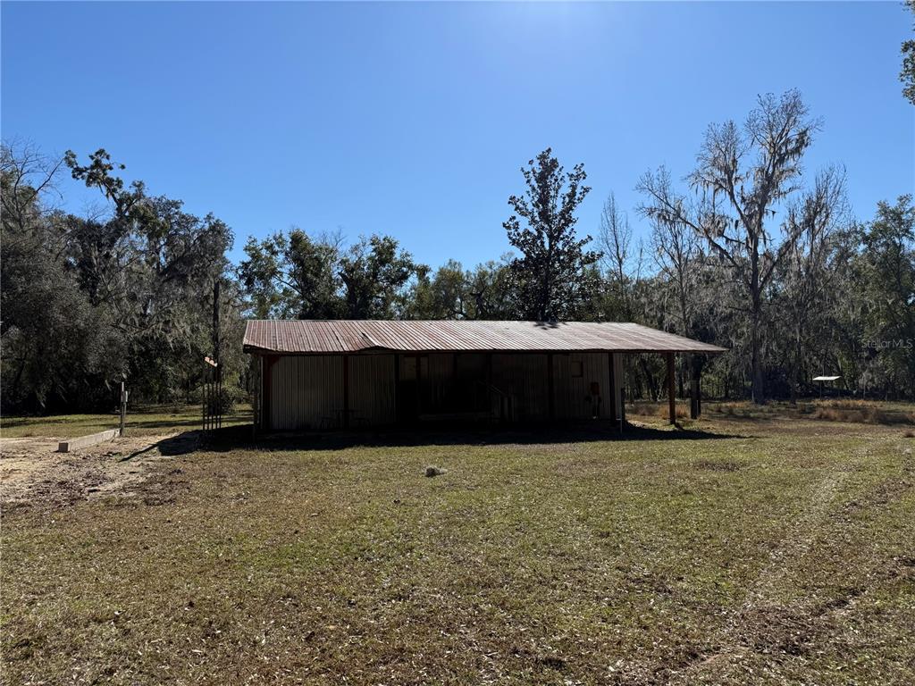 18630 Bradshaw Road Dade City, FL 33523 - Photo 6 of 43 a front view of a house with a yard