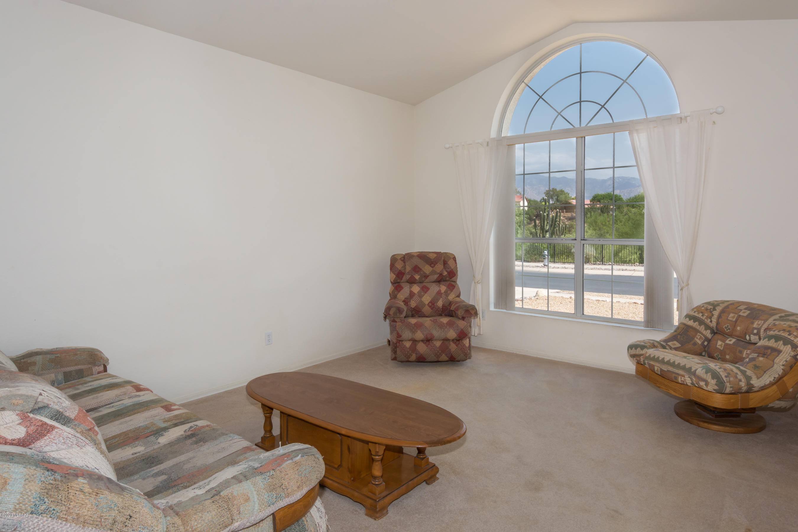 11341 Silver Pheasant Loop Oro Valley, AZ 85737 - Photo 3 of 41 a living room with furniture and a window