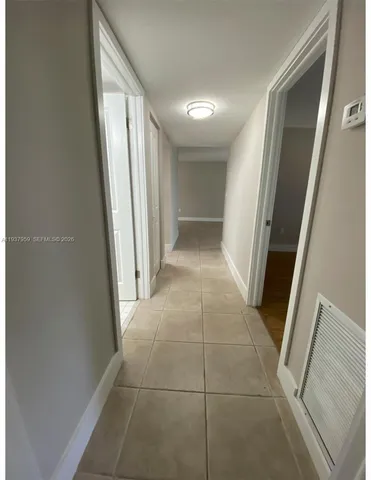 a view of entryway with window and stairs