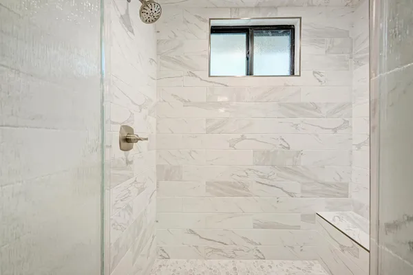 a large kitchen with kitchen island a sink stainless steel appliances and cabinets