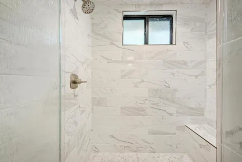 a large kitchen with kitchen island a sink stainless steel appliances and cabinets