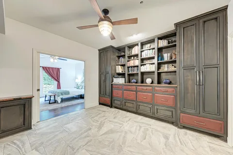 a bathroom with a double vanity sink mirror and shower