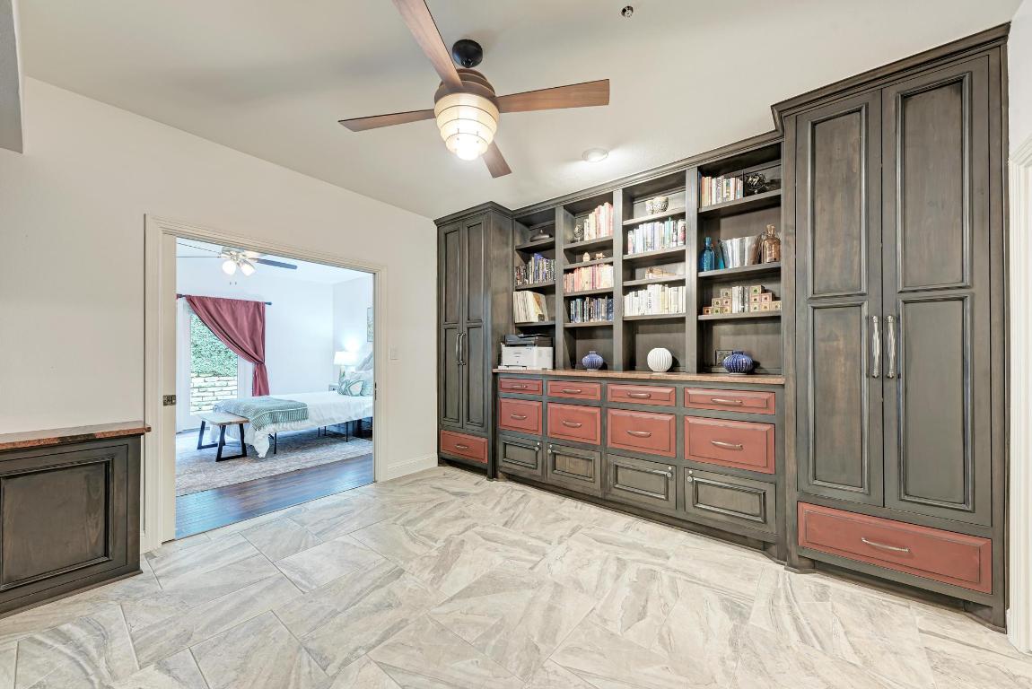 1115 West 7th Street, Unit 106 Austin, TX 78703 - Photo 23 of 40 a bedroom with furniture and window