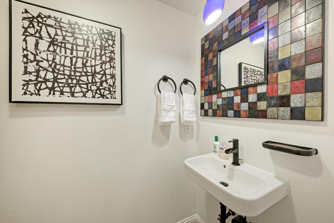 1115 West 7th Street, Unit 106 Austin, TX 78703 - Photo 26 of 40 a bathroom with a sink and a mirror
