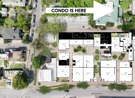 a view of a patio with table and chairs under an umbrella