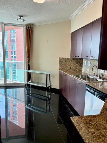 a bathroom with a sink toilet vanity and shower