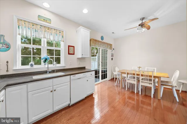 a kitchen with granite countertop a dining table chairs and granite counter tops