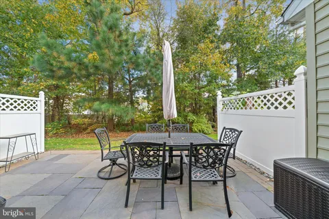 a patio with table and chairs