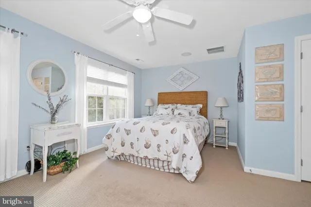 a bedroom with a bed and a fireplace