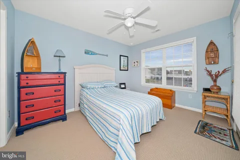 a bedroom with bed and window