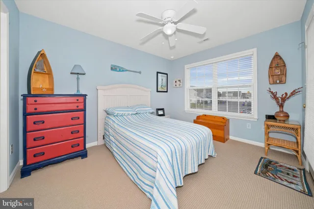 a bedroom with bed and window