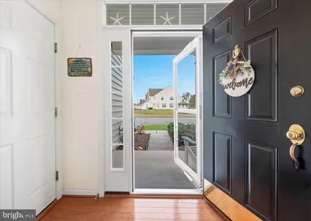 a view of a hallway with dining area