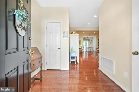 a view of a hallway with dining area