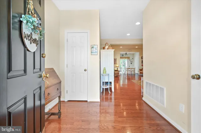 a view of a hallway with dining area