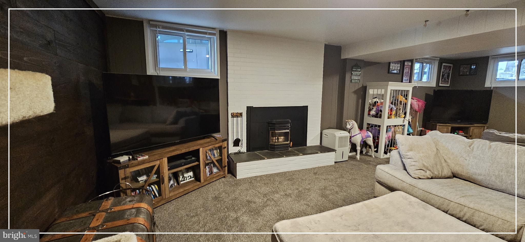 1109 Grinnell Road Wilmington, DE 19803 - Photo 13 of 29 a living room with furniture and a flat screen tv
