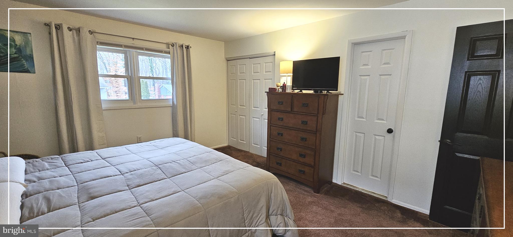 1109 Grinnell Road Wilmington, DE 19803 - Photo 17 of 29 a bedroom with a bed and a flat screen tv