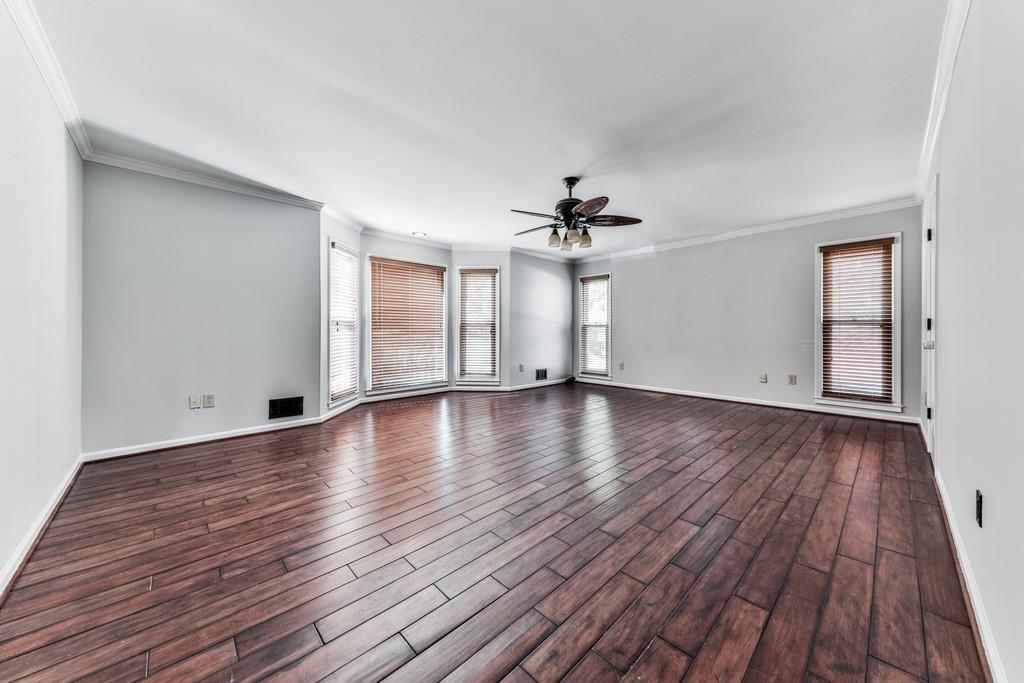 4510 North Slope Circle Marietta, GA 30066 - Photo 15 of 37 a view of empty room with wooden floor and fan