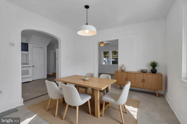 a kitchen with a stove a sink and a refrigerator