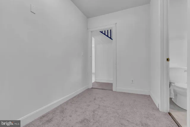 a bathroom with a bath tub and a window