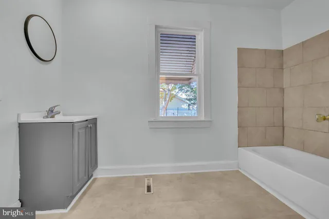 a view of a hallway with windows