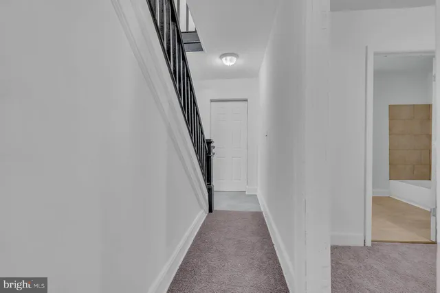 a view of an empty room and entryway