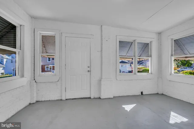 a view of an empty room and window