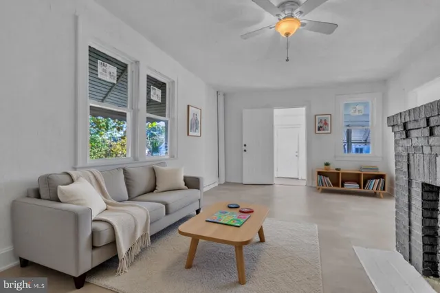 a view of an empty room with a fireplace