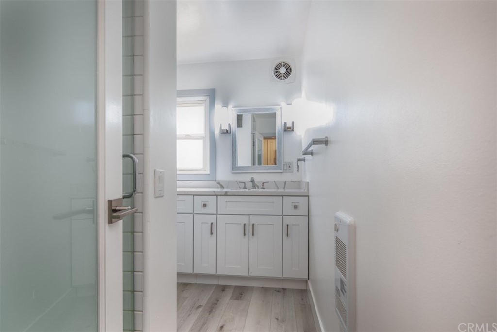 319 Cypress Drive, Unit B Laguna Beach, CA 92651 - Photo 13 of 39 a bathroom with a sink and a mirror