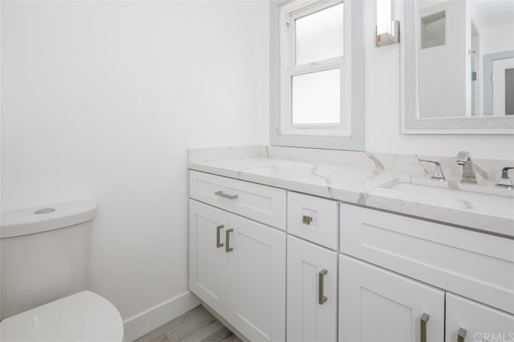 319 Cypress Drive, Unit B Laguna Beach, CA 92651 - Photo 16 of 39 a bathroom with a sink toilet and window