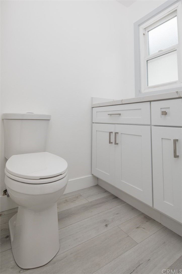 319 Cypress Drive, Unit B Laguna Beach, CA 92651 - Photo 17 of 39 a bathroom with a toilet and a sink