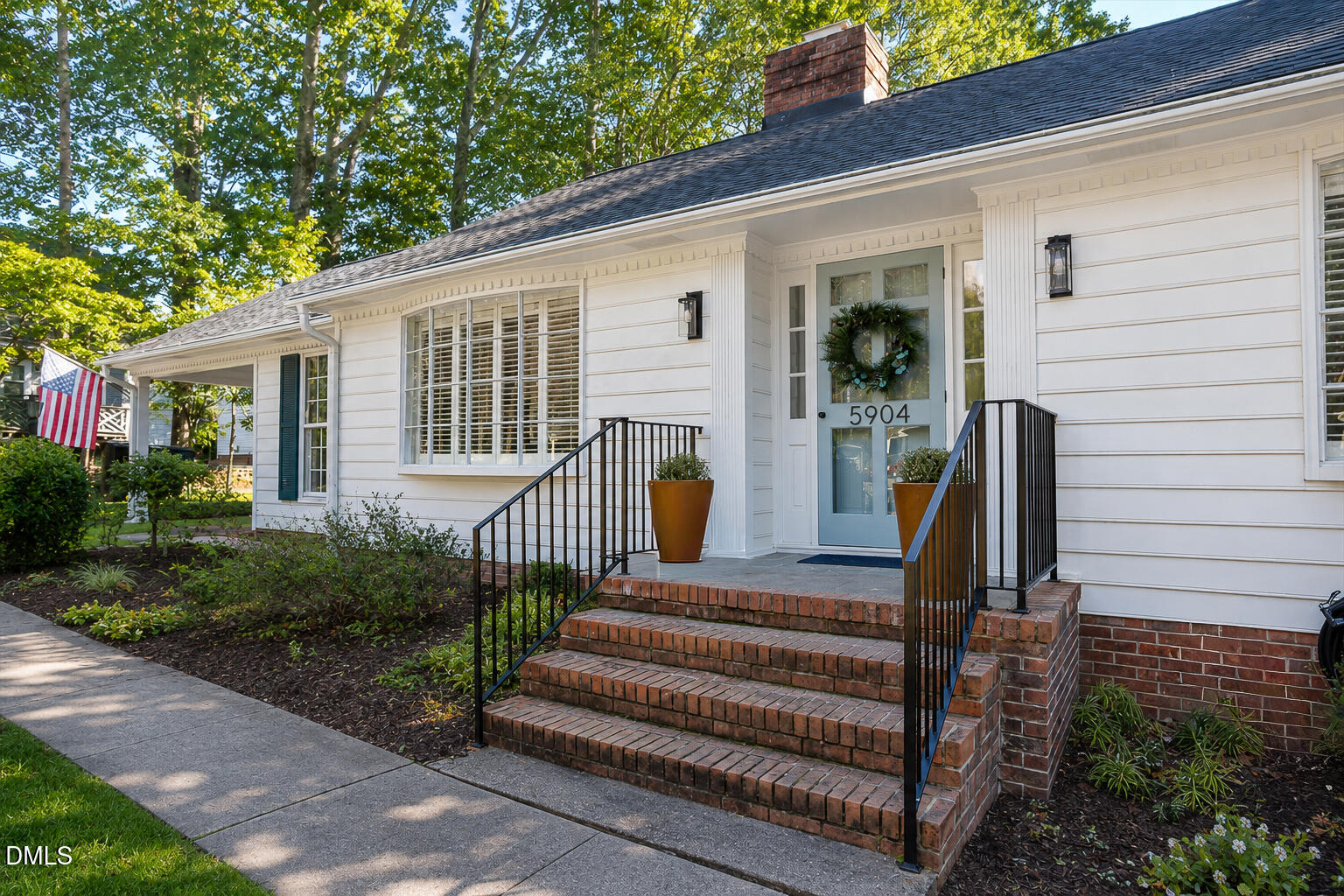 5904 Volant Drive Raleigh, NC 27609 - Photo 2 of 42 a front view of a house with a garden