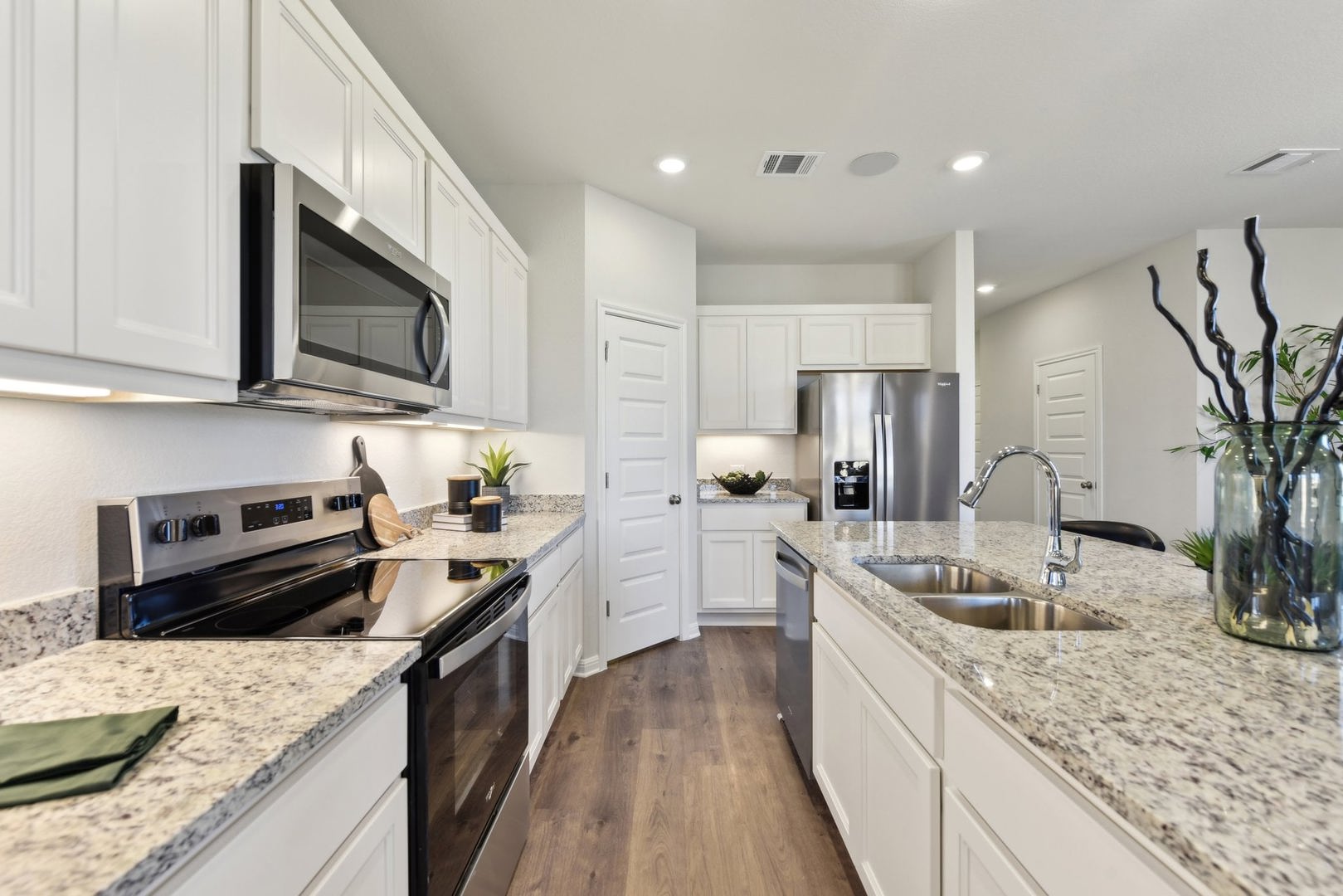 253 Firefox Way Jarrell, TX 76537 - Photo 6 of 17 Culinary delights await in this bright kitchen with ample counter space and modern appliances.