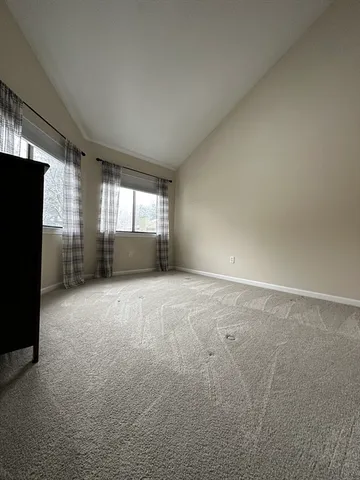 a view of empty room with windows