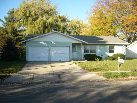 339 Irene Rochelle, IL 61068 - Photo 1 of 5 a front view of a house with a yard