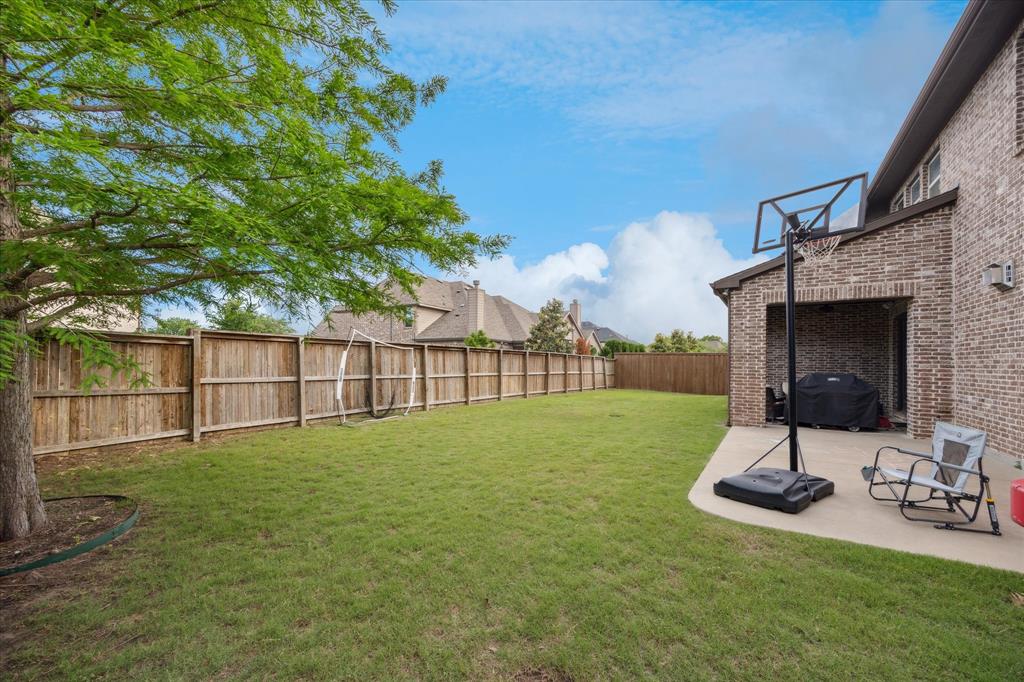 580 Butchart Drive Prosper, TX 75078 - Photo 35 of 40 View of yard featuring a patio