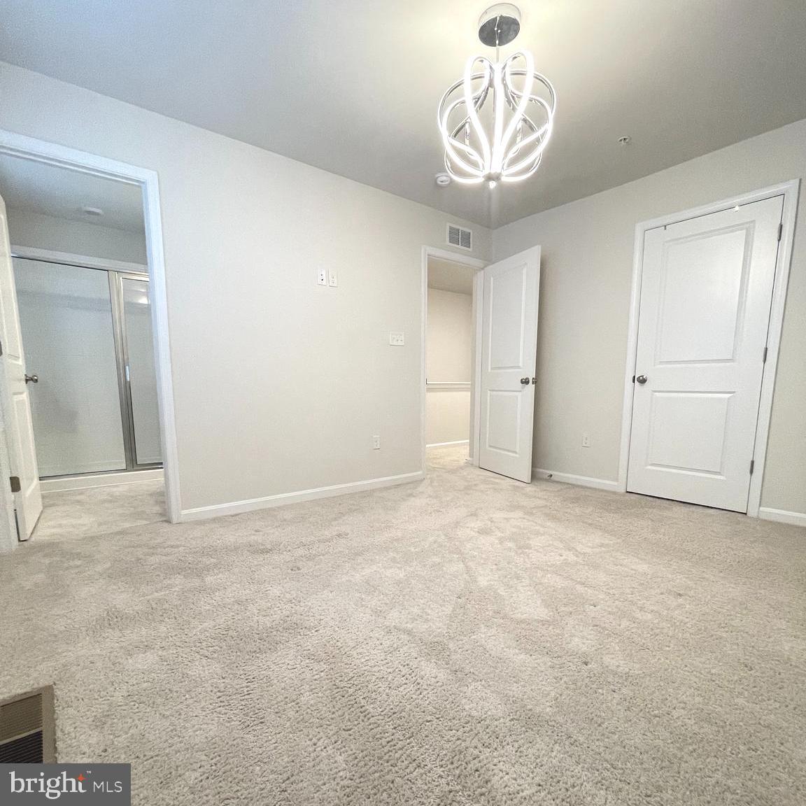 2709 Princess Victoria Way Bowie, MD 20721 - Photo 15 of 31 a view of an empty room and a chandelier fan