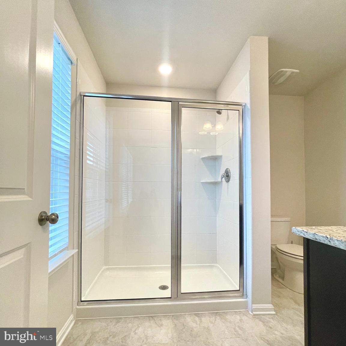 2709 Princess Victoria Way Bowie, MD 20721 - Photo 18 of 31 a bathroom with a glass shower door